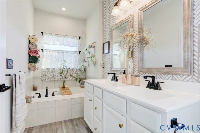 a bedroom that has a bed and a chair in it