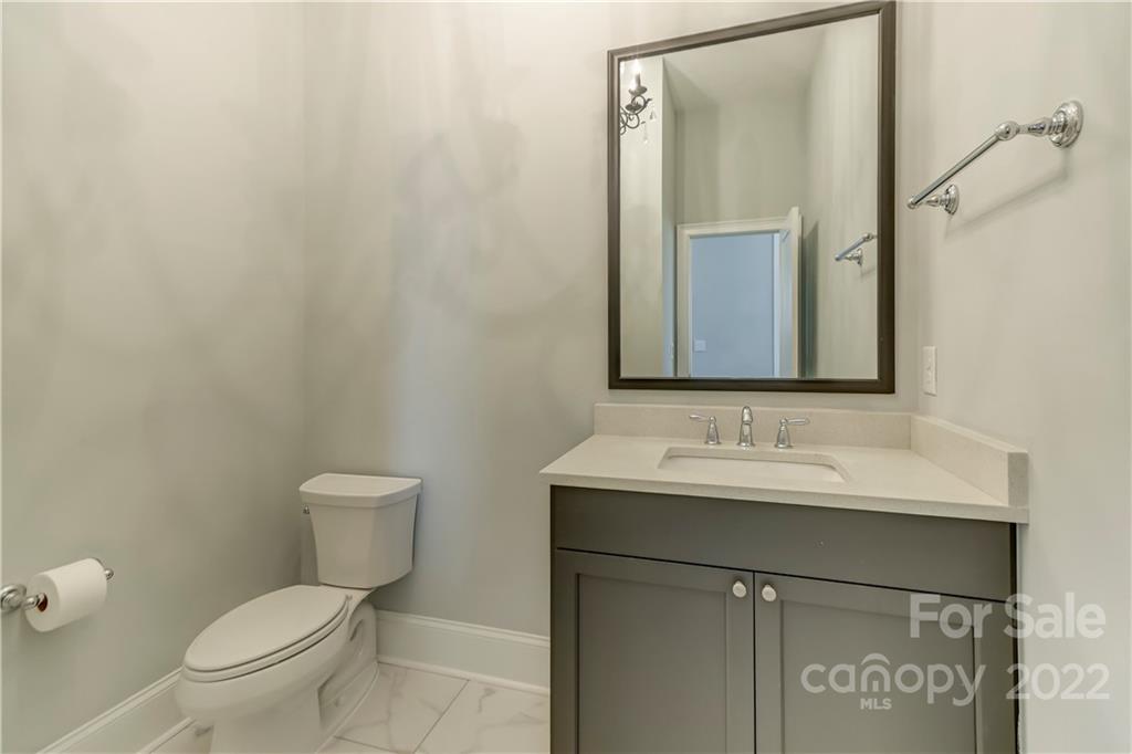 320 Sensibility Circle Fort Mill, SC 29708 - Photo 12 of 48 a bathroom with a toilet sink and mirror