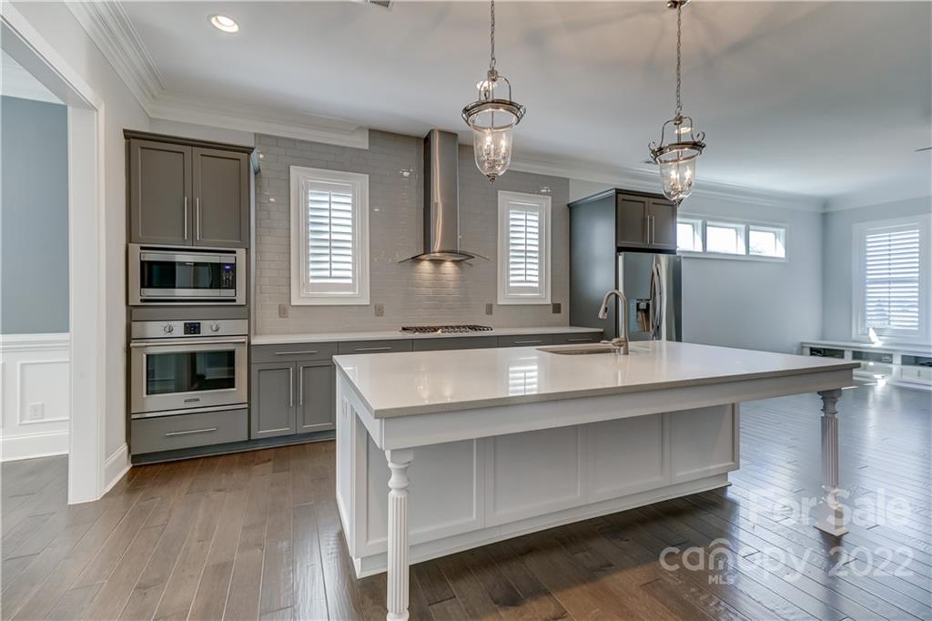 320 Sensibility Circle Fort Mill, SC 29708 - Photo 13 of 48 a kitchen with a center island appliances and cabinets