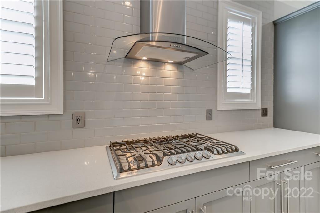 320 Sensibility Circle Fort Mill, SC 29708 - Photo 17 of 48 a kitchen with a stove a sink and a window
