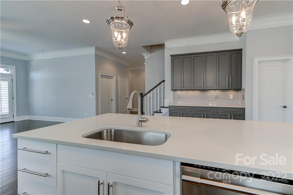 320 Sensibility Circle Fort Mill, SC 29708 - Photo 18 of 48 a kitchen with a sink a counter space and cabinets