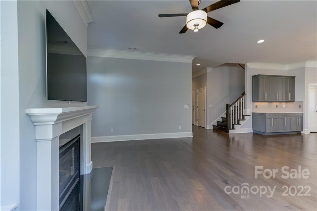 320 Sensibility Circle Fort Mill, SC 29708 - Photo 20 of 48 a view of an empty room with a fireplace and a window