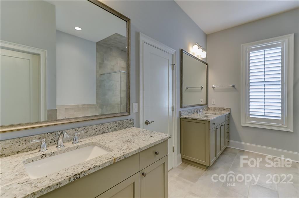 320 Sensibility Circle Fort Mill, SC 29708 - Photo 26 of 48 a bathroom with a granite countertop sink and a mirror