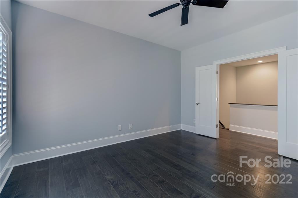 320 Sensibility Circle Fort Mill, SC 29708 - Photo 33 of 48 a view of an empty room with wooden floor