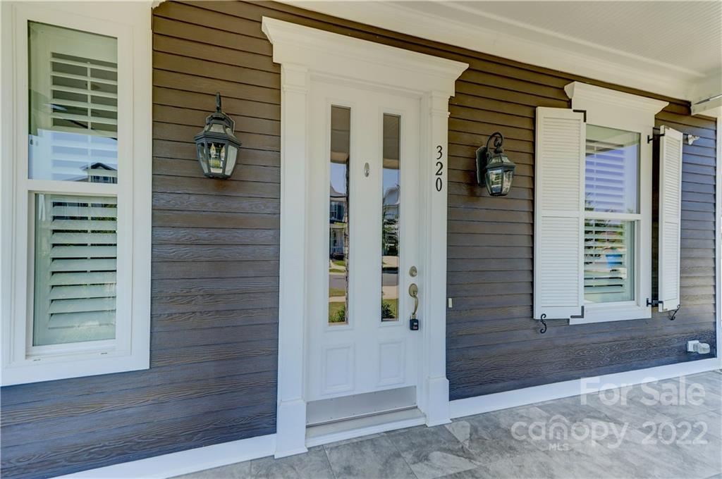 320 Sensibility Circle Fort Mill, SC 29708 - Photo 5 of 48 a front view of a house with a door and a window
