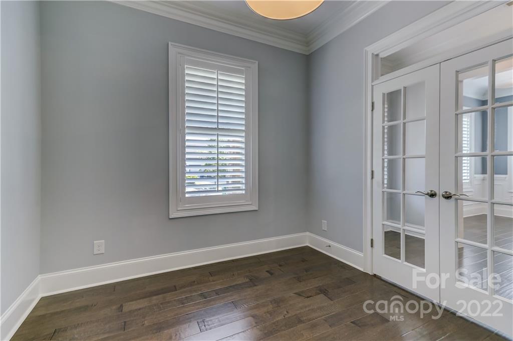 320 Sensibility Circle Fort Mill, SC 29708 - Photo 8 of 48 an empty room with wooden floor and windows