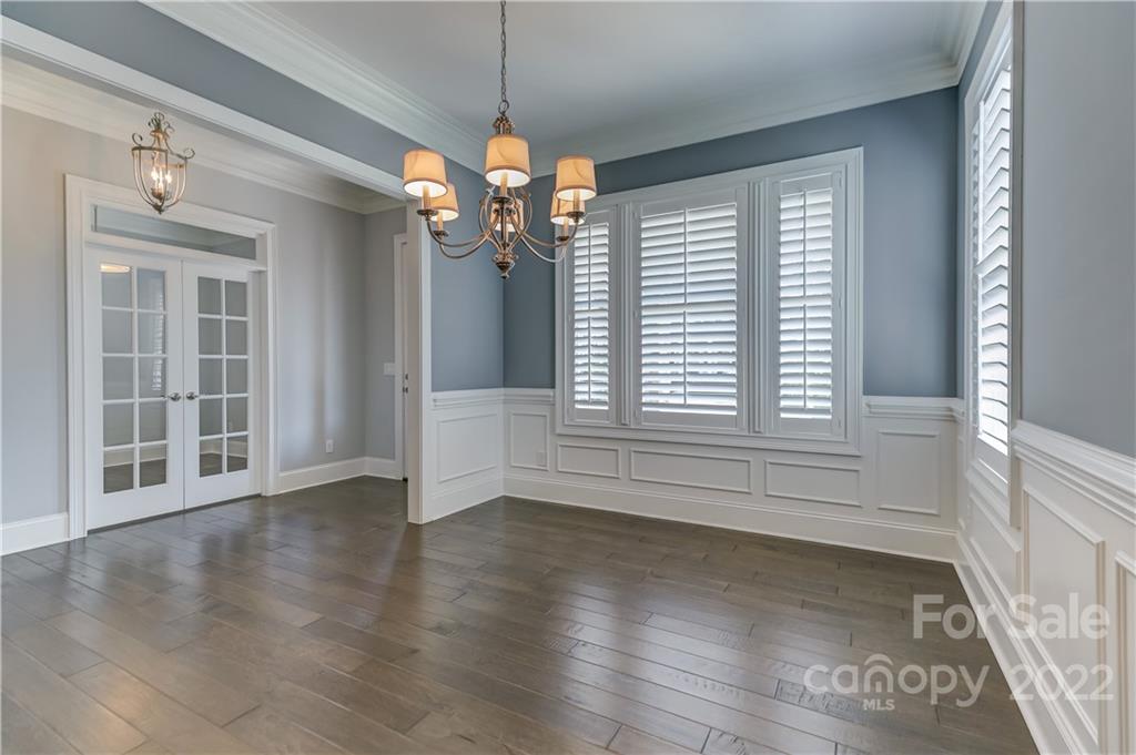 320 Sensibility Circle Fort Mill, SC 29708 - Photo 10 of 48 wooden floor in an empty room with a window