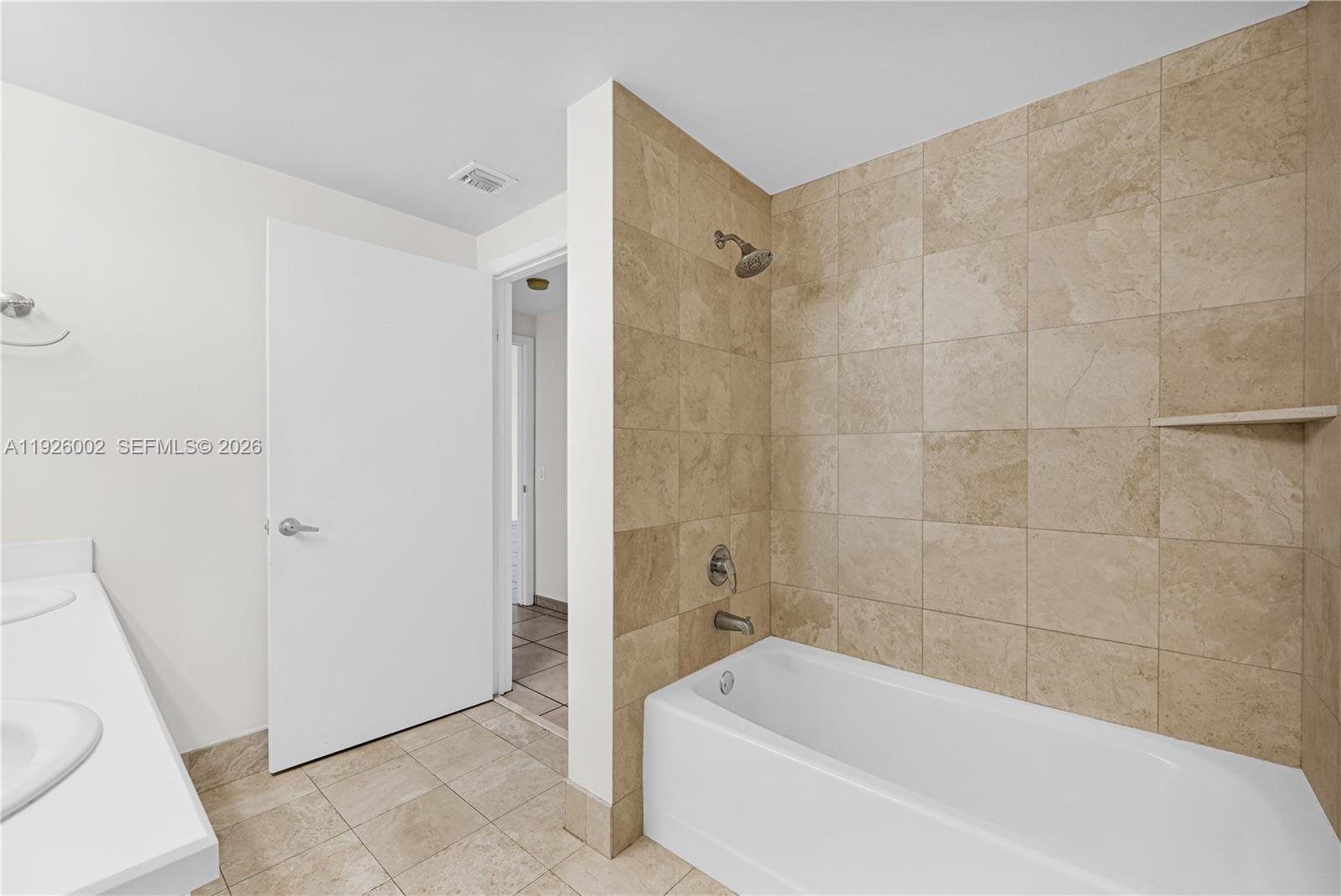 2475 Brickell Avenue, Unit 703 Miami, FL 33129 - Photo 20 of 30 a bathroom with a bathtub and a toilet