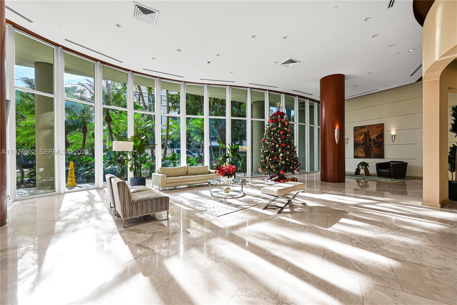 2475 Brickell Avenue, Unit 703 Miami, FL 33129 - Photo 23 of 30 a living room filled with furniture and a large window