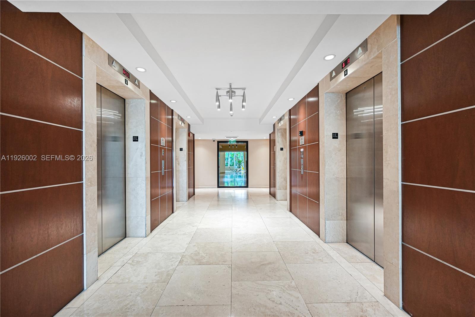 2475 Brickell Avenue, Unit 703 Miami, FL 33129 - Photo 25 of 30 a view of a hallway with wooden shelves