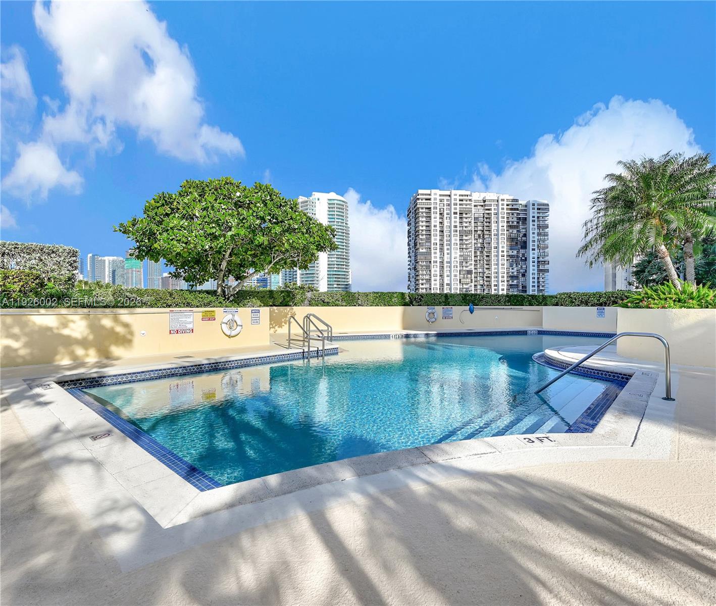 2475 Brickell Avenue, Unit 703 Miami, FL 33129 - Photo 27 of 30 a view of a swimming pool with a yard