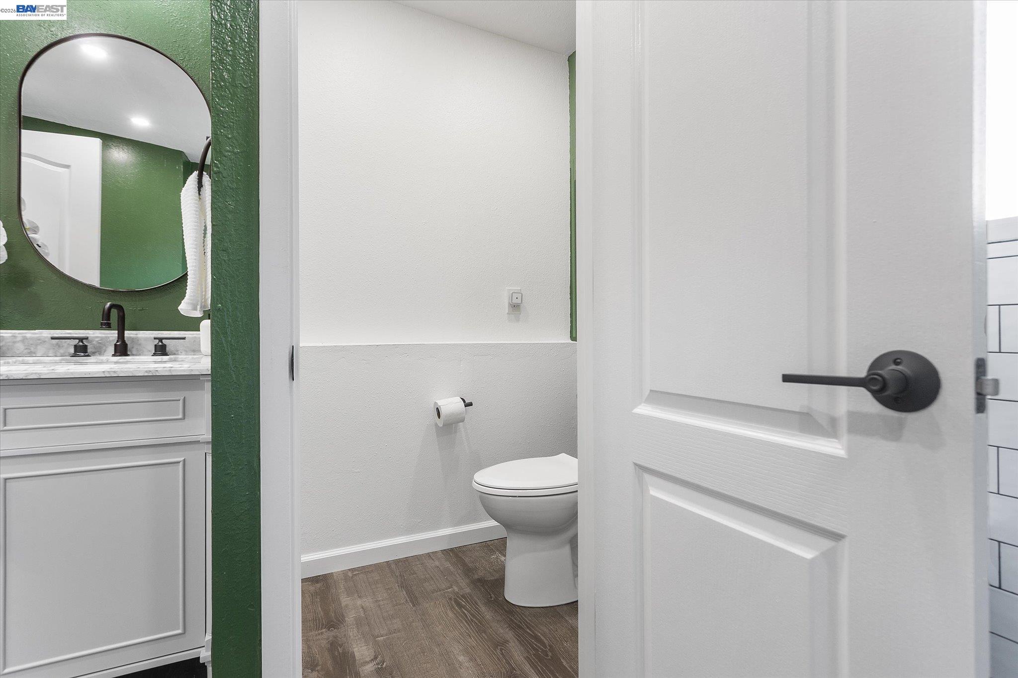 16683 Kildare Road Castro Valley, CA 94546 - Photo 57 of 77 a bathroom with a toilet sink and mirror