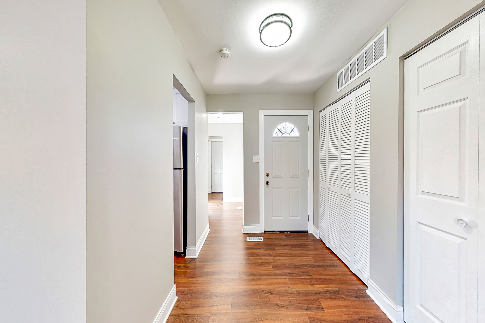 141 Mellbrook Road Bolingbrook, IL 60440 - Photo 11 of 20 a view of a hallway with wooden floor