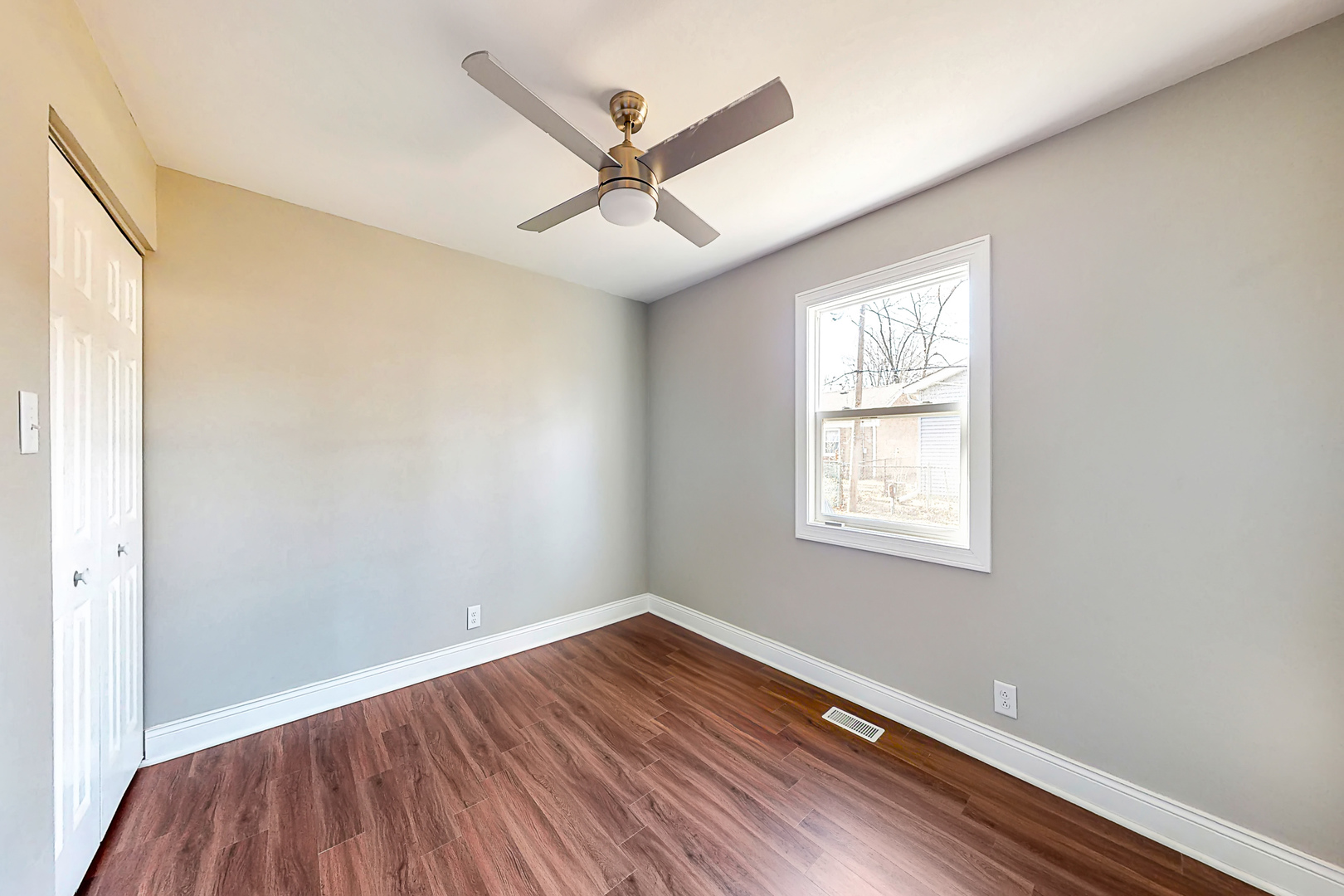141 Mellbrook Road Bolingbrook, IL 60440 - Photo 15 of 20 a view of a room with wooden floor and a ceiling fan