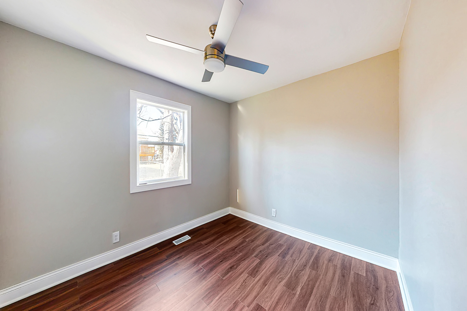 141 Mellbrook Road Bolingbrook, IL 60440 - Photo 16 of 20 an empty room with wooden floor chandelier fan and windows