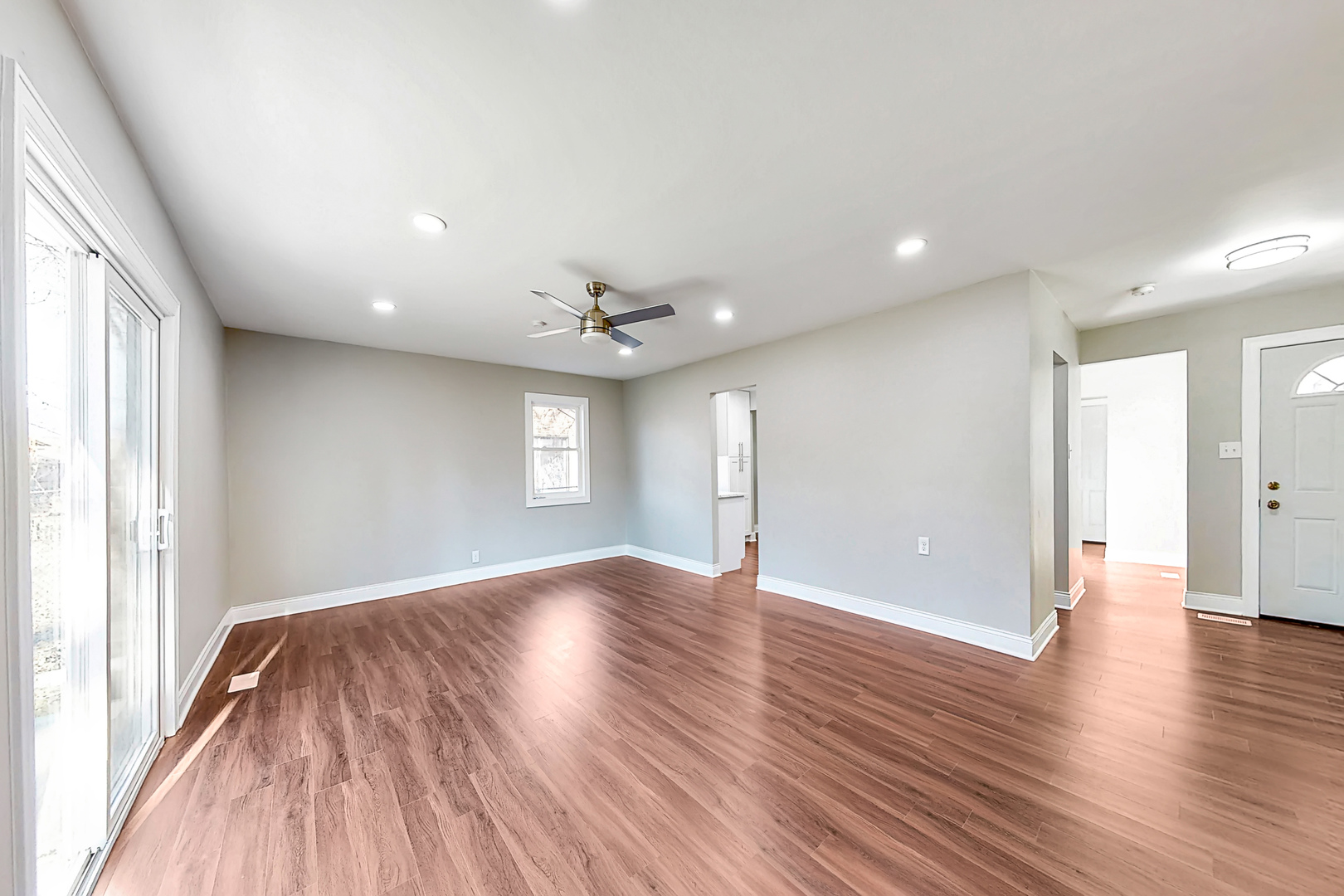 141 Mellbrook Road Bolingbrook, IL 60440 - Photo 5 of 20 an empty room with wooden floor and windows