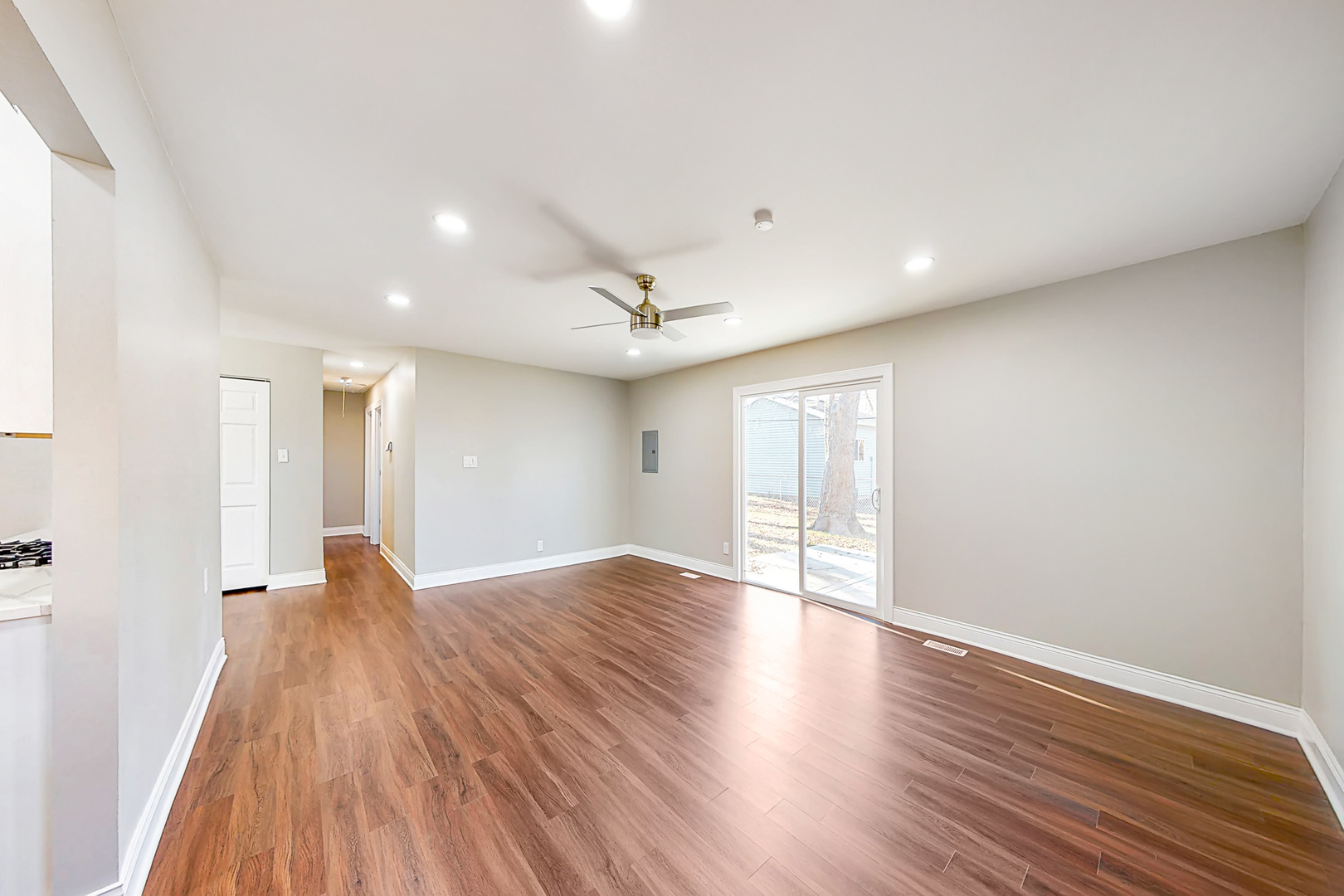 141 Mellbrook Road Bolingbrook, IL 60440 - Photo 6 of 20 an empty room with wooden floor and windows