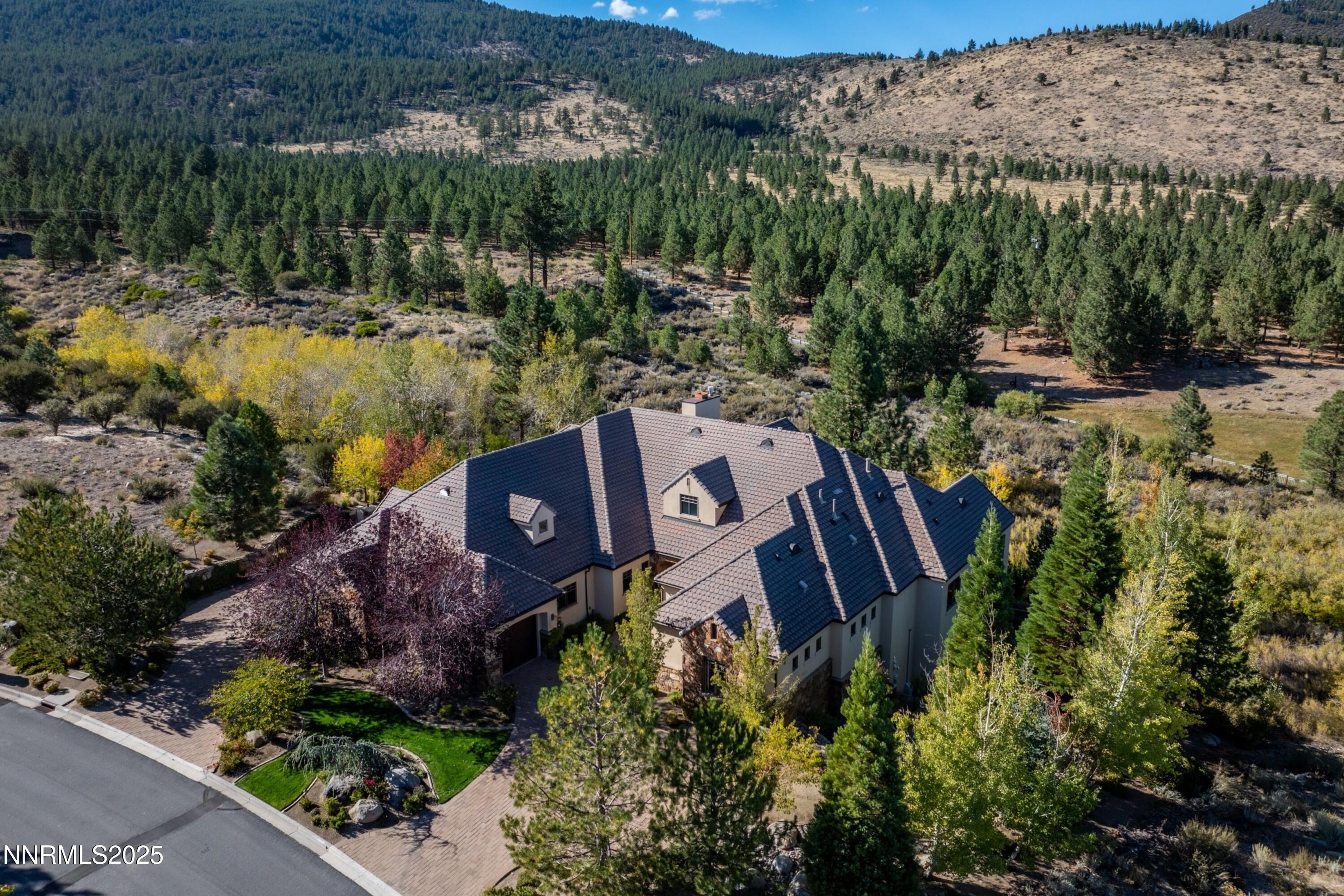 aerial view of a house with a lake view