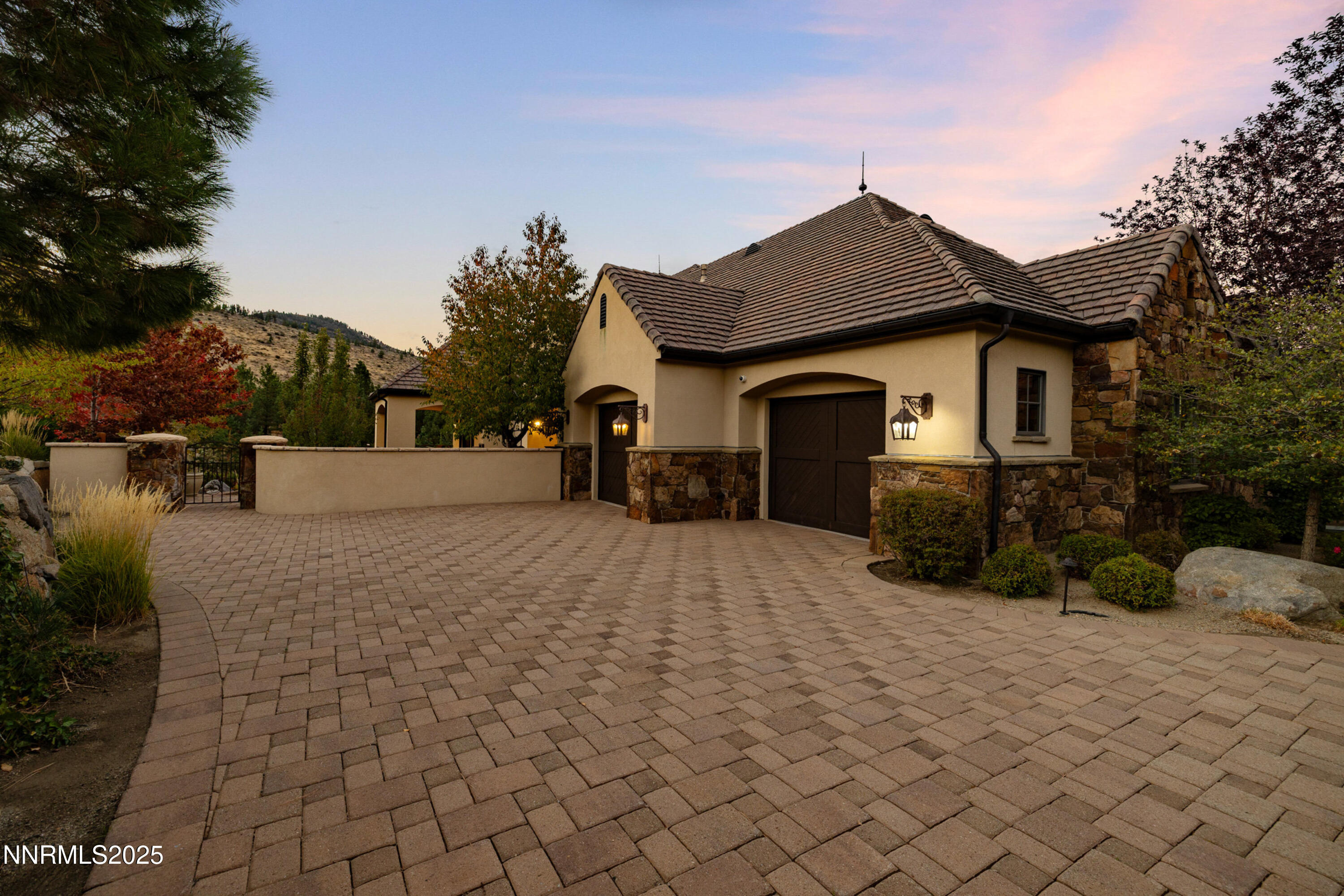 5775 Lausanne Drive Reno, NV 89511 - Photo 4 of 69 a view of a white house with a yard and large tree