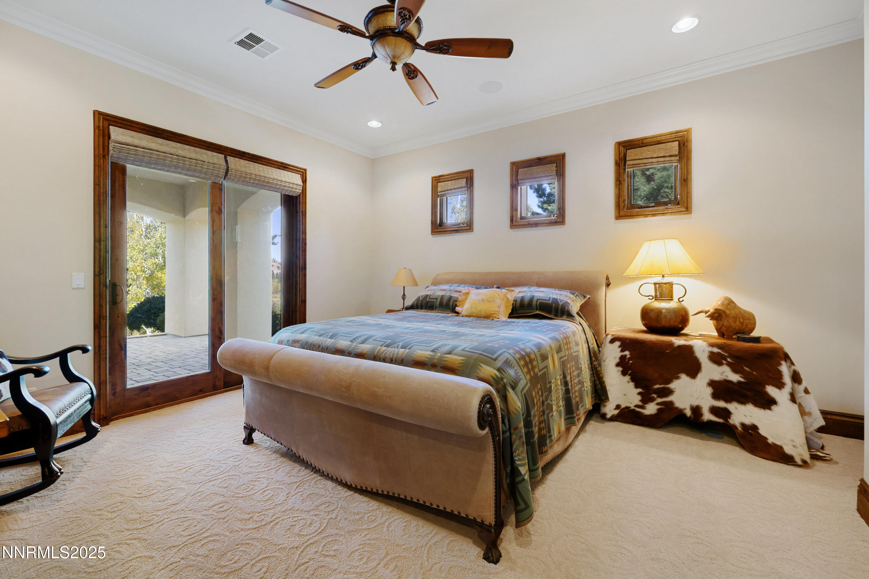 5775 Lausanne Drive Reno, NV 89511 - Photo 42 of 69 a spacious bedroom with a bed and a chandelier