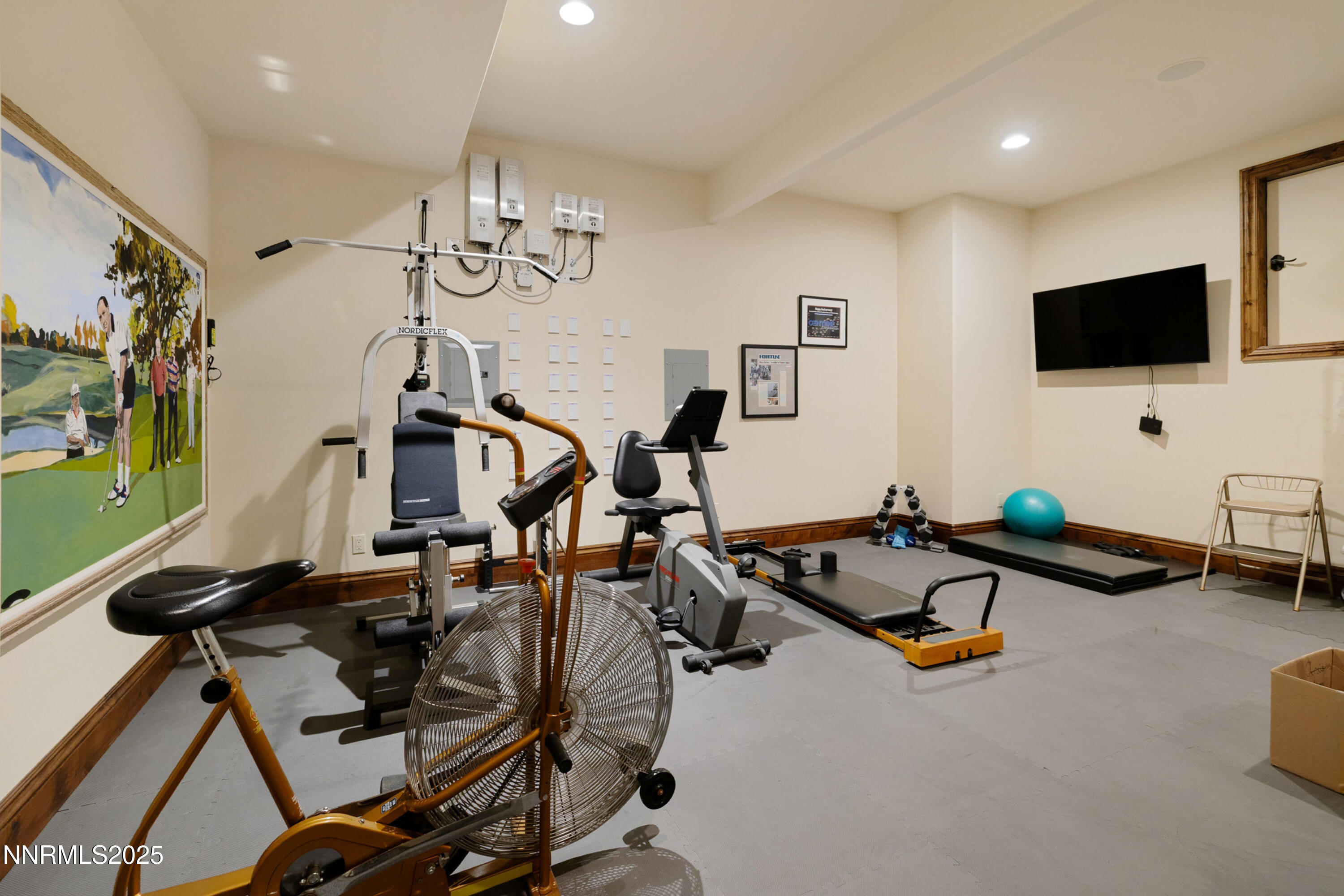 5775 Lausanne Drive Reno, NV 89511 - Photo 48 of 69 a room with gym equipment and flat screen tv
