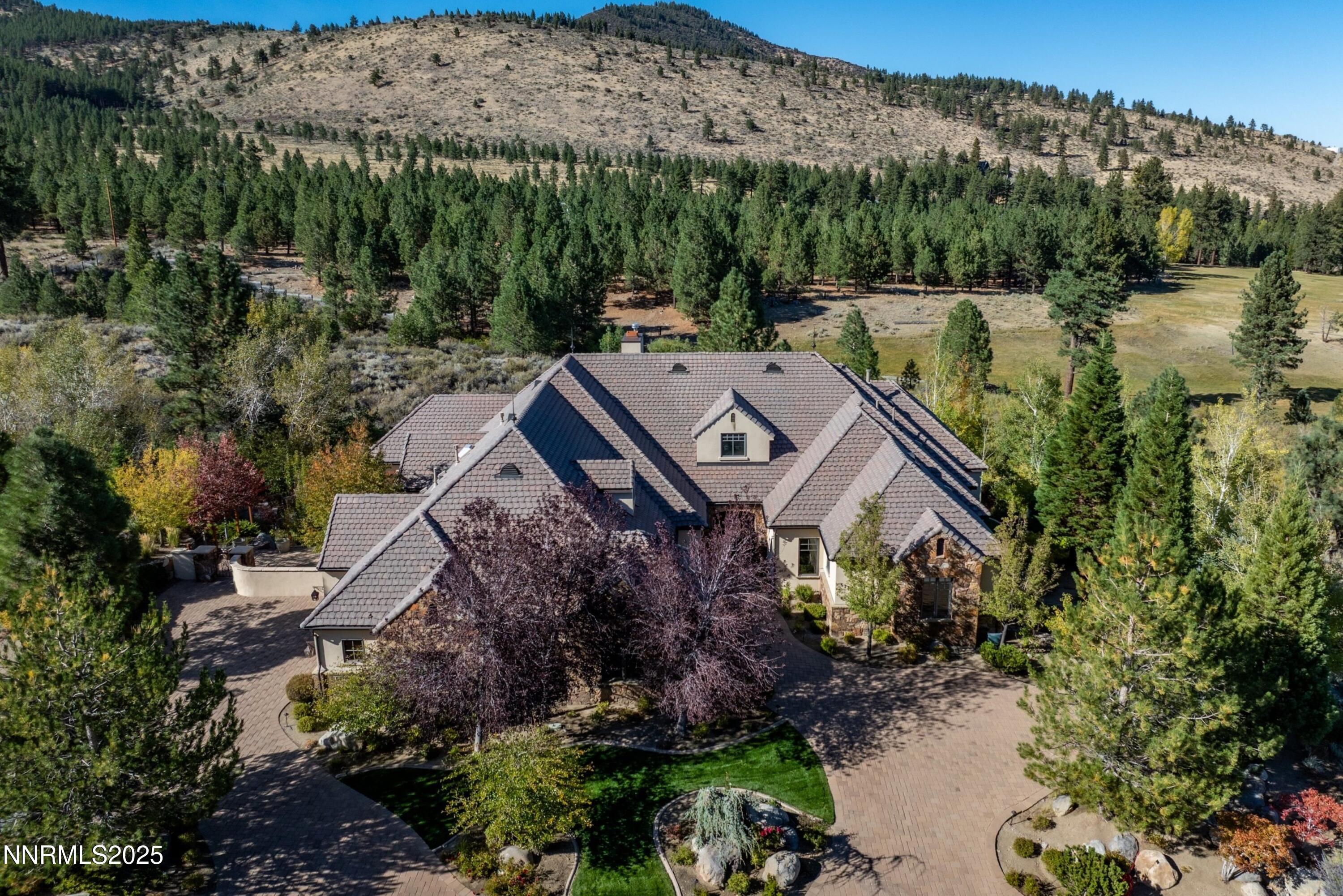 5775 Lausanne Drive Reno, NV 89511 - Photo 5 of 69 a view of a house with a mountain in the background