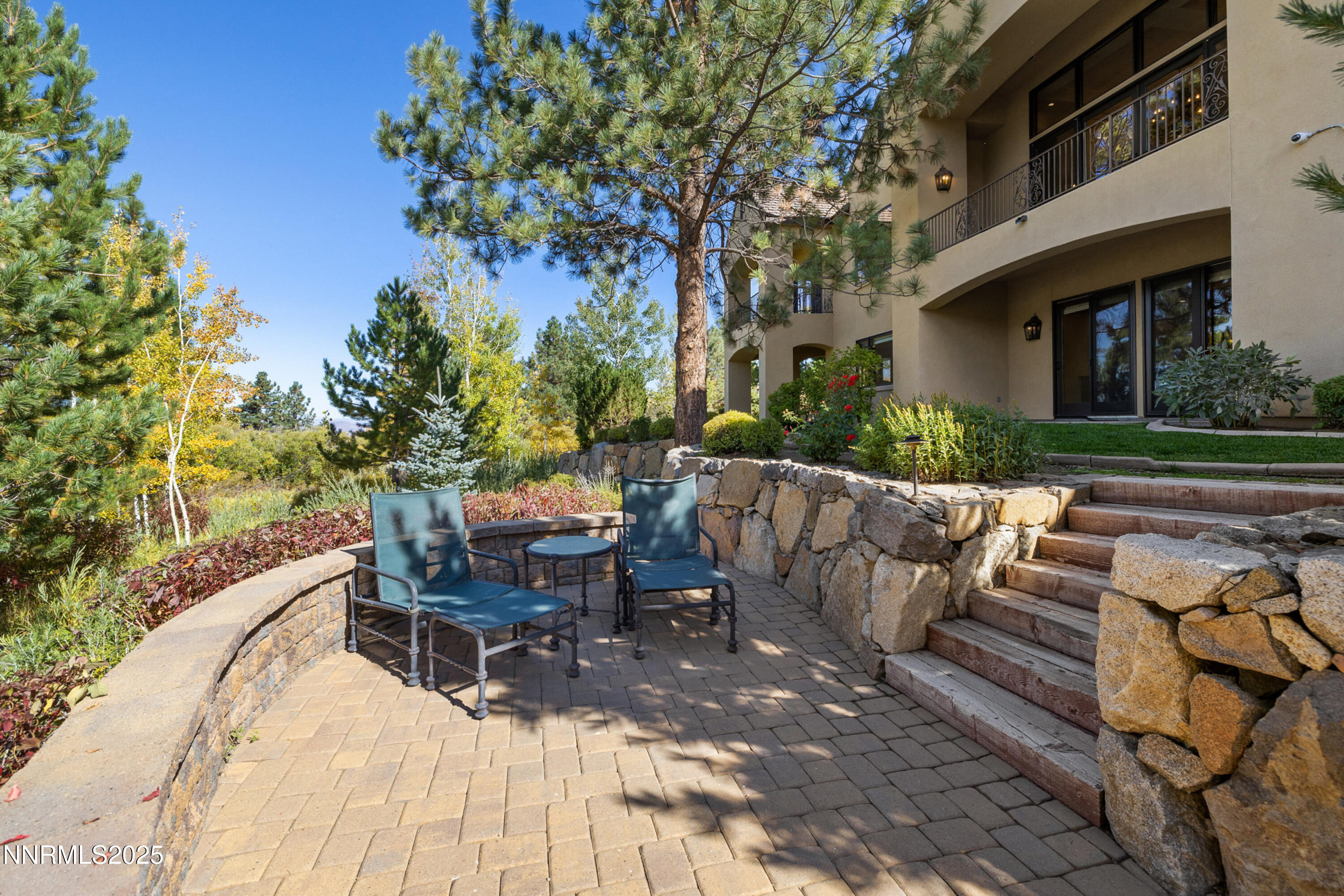 5775 Lausanne Drive Reno, NV 89511 - Photo 53 of 69 a view of a patio with table and chairs potted plants and large tree