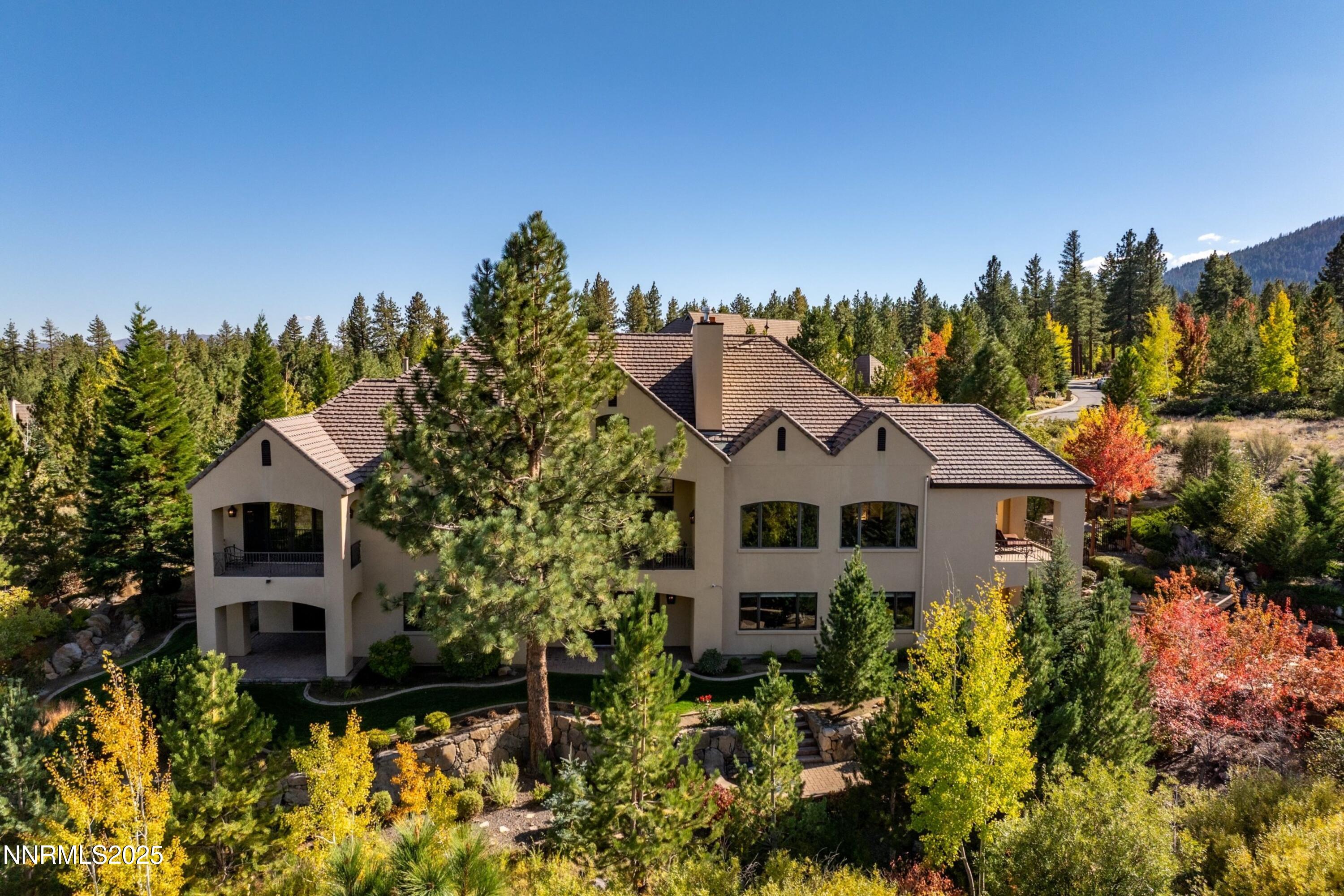 5775 Lausanne Drive Reno, NV 89511 - Photo 69 of 69 a front view of a house with a yard and trees