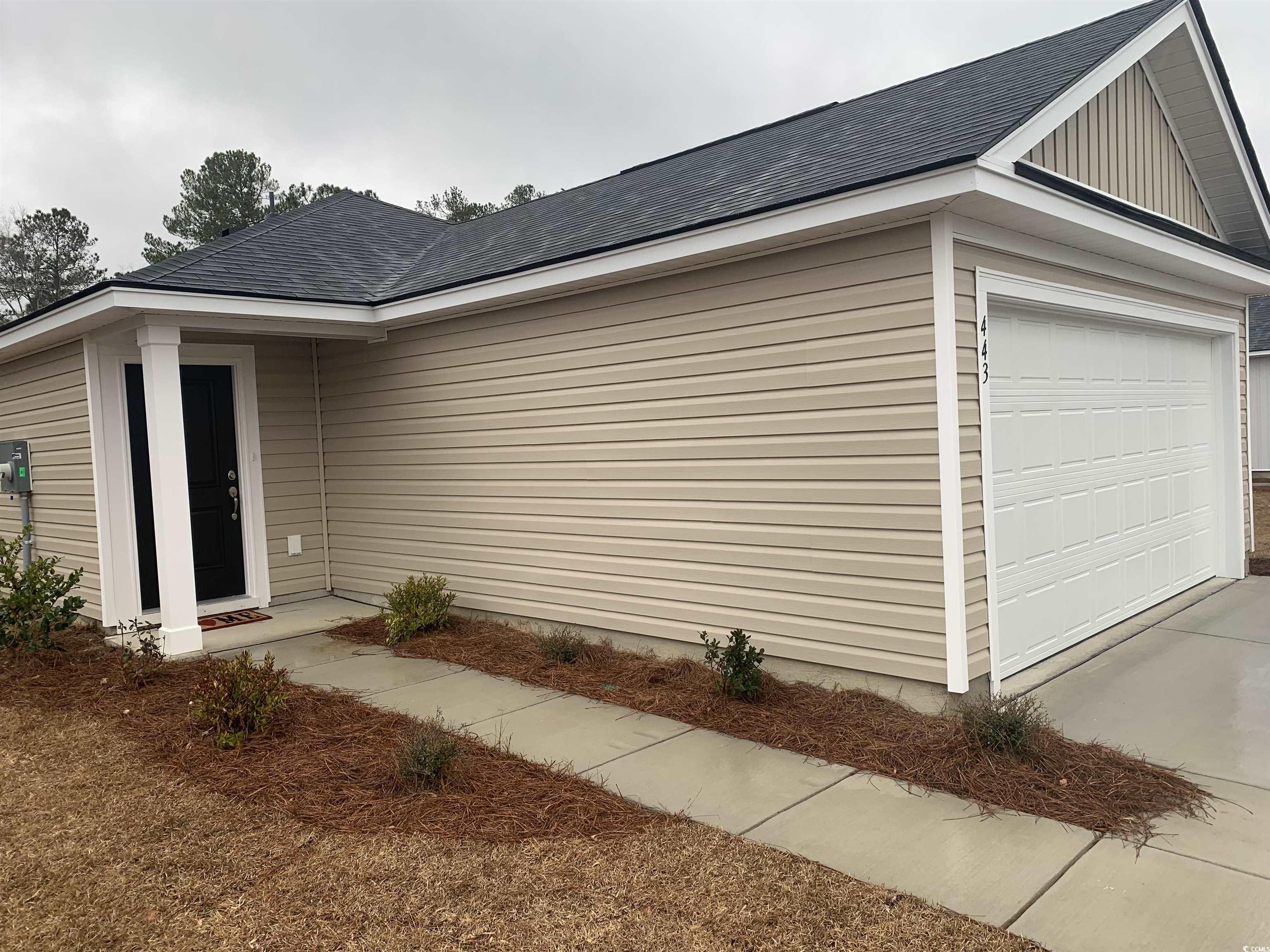 443 Ribbon Rail Way Loris, SC 29569 - Photo 1 of 12 View of side of home featuring a garage, a shingle