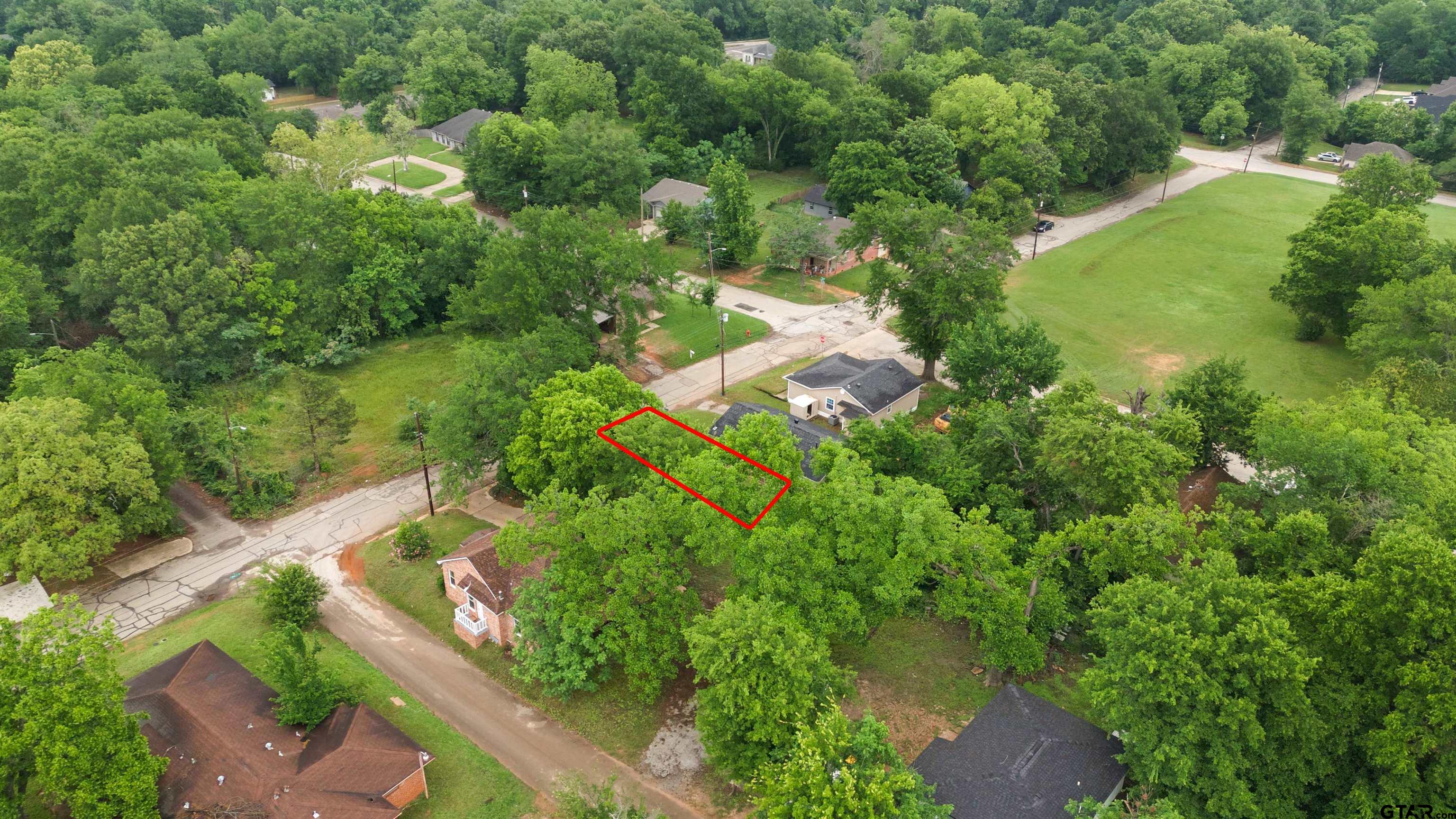 730 West Nutbush Street Tyler, TX 75702 - Photo 4 of 9 an aerial view of residential house with outdoor space and trees all around