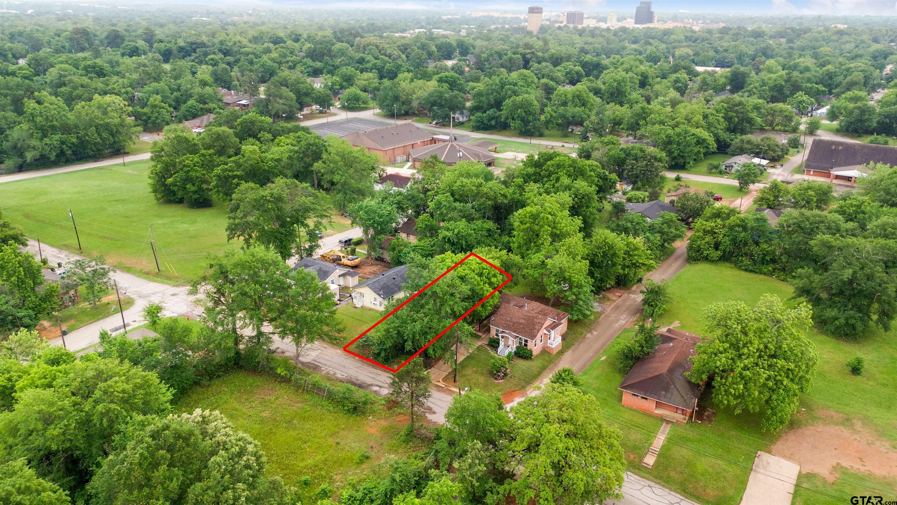 730 West Nutbush Street Tyler, TX 75702 - Photo 6 of 9 an aerial view of residential house with outdoor space and trees all around