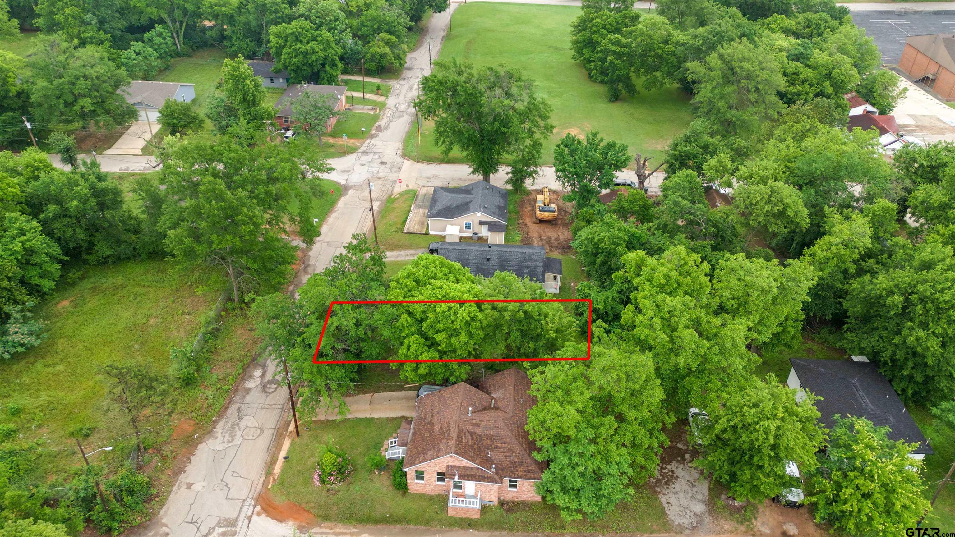 730 West Nutbush Street Tyler, TX 75702 - Photo 7 of 9 an aerial view of residential house with outdoor space and trees all around