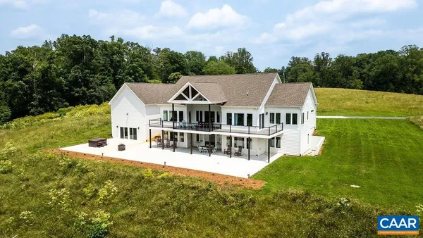 a kitchen with stainless steel appliances granite countertop a stove top oven a sink a counter space and cabinets