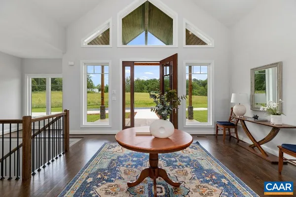 a kitchen with a table chairs stove and cabinets