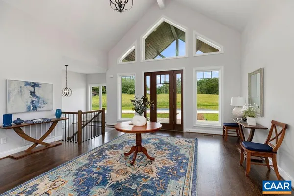 a kitchen with cabinets and wooden floor