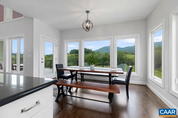a spacious bedroom with a bed and large window