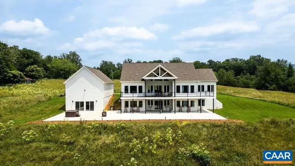 a view of house with backyard porch and garden