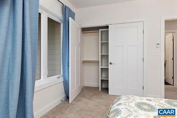 a view of a garden with a building in the background