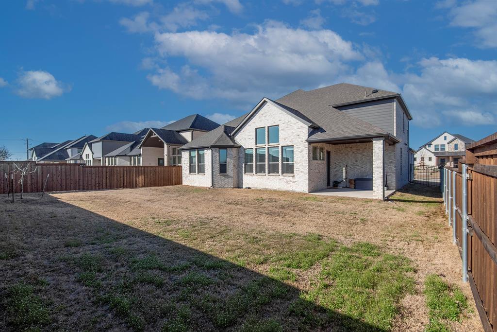 16650 Nightshade Road Frisco, TX 75033 - Photo 37 of 40 a front view of a house with a garden