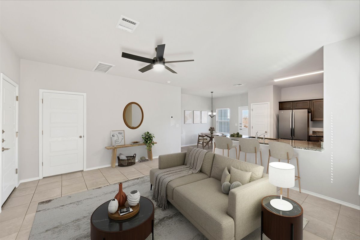1202 Garland Road Georgetown, TX 78626 - Photo 2 of 28 Open-concept living area featuring a ceiling fan, tiled flooring, and neutral wall tones