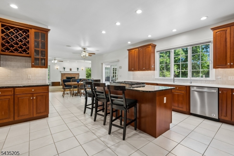 12 Oak Hill Road Bernards, NJ 07920 - Photo 10 of 33 a kitchen with stainless steel appliances granite countertop a stove a sink and a microwave