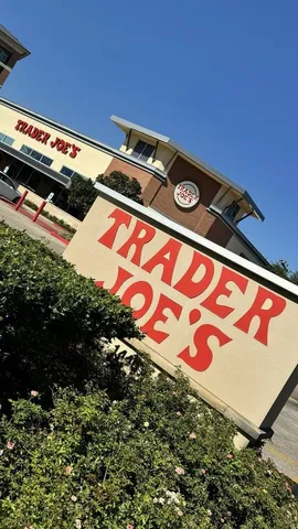 a blue and white umbrella sitting in front of a house
