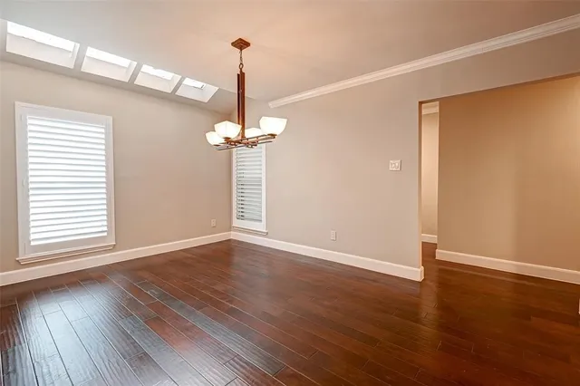 a kitchen with kitchen island granite countertop a sink and stainless steel appliances