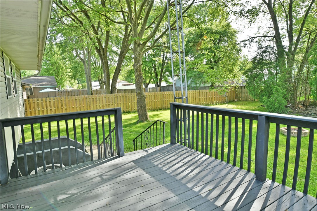 2470 North Road Southeast Warren, OH 44484 - Photo 11 of 35 Deck featuring a lawn
