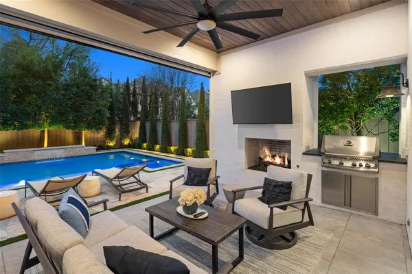 a view of a patio with a dining table and chairs