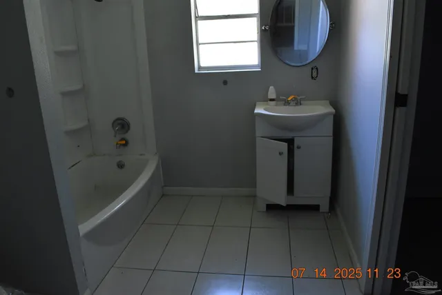 a bathroom with a sink a toilet and bathtub