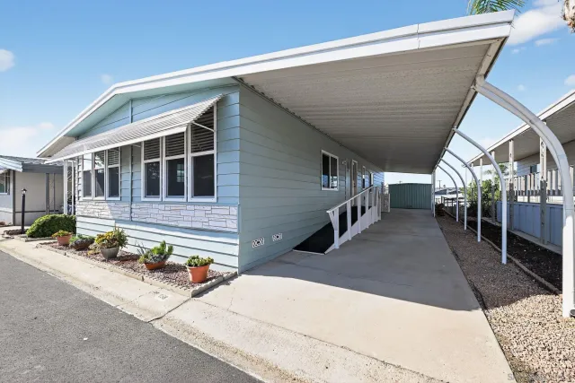 a front view of a house with stairs