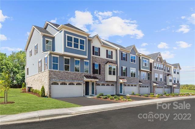 2061 Dornoch Road, Unit 1022B Tega Cay, SC 29708 - Photo 1 of 11 a front view of a building with street view