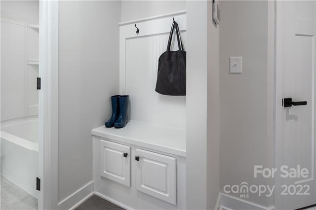 2061 Dornoch Road, Unit 1022B Tega Cay, SC 29708 - Photo 9 of 11 a bathroom with a sink and a mirror
