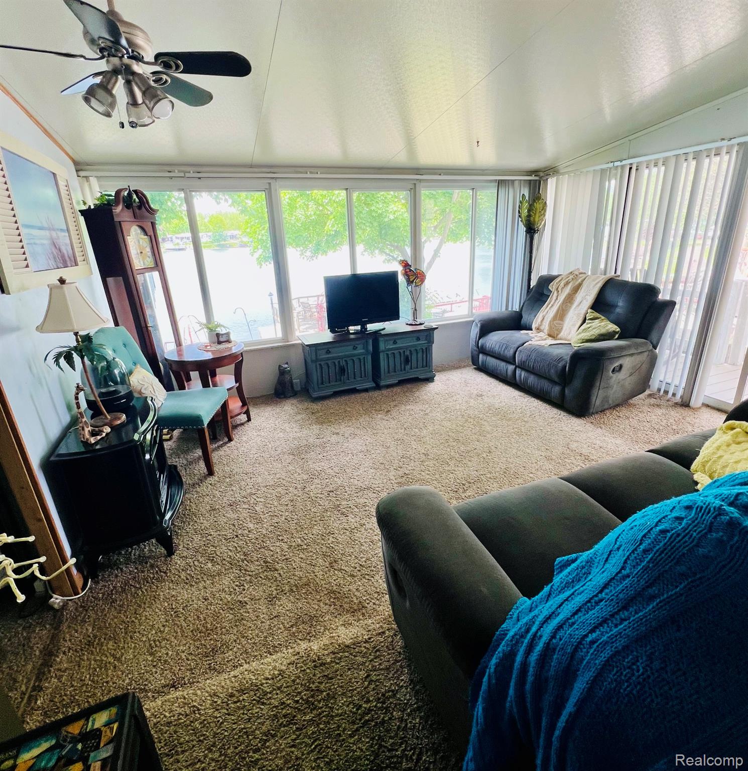 10001 Goodall Road, Unit 404 Durand, MI 48429 - Photo 14 of 50 Sunroom featuring lofted ceiling and carpet flooring